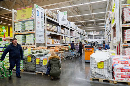 Kirov, Russia - November 23, 2019: Trading hall with goods and people in it in the store Leroy Merlin. Building materials, things for the house and buyers in the big shopのeditorial素材