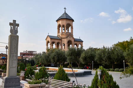 Tbilisi, Georgia - October 21, 2019: Belfry near big orthodox cathedral St. Trinity or Chirch Sameba...