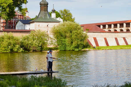 Kirillov, Russia - June 18, 2019: Fisherman people on the lake shore on a summer day near the Kirillo-Belozersky monasteryのeditorial素材