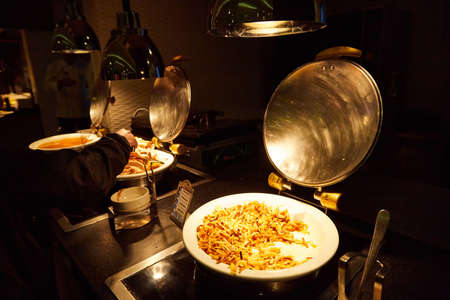 Food in the bowl in the self-service buffet with all inclusive in the hotel in Turkeyのeditorial素材