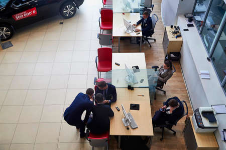 Murmansk, Russia - June 21, 2019: Managers in showroom with cars of dealership Toyota in Murmansk city in Russiaのeditorial素材