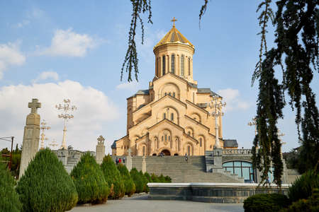 Tbilisi, Georgia - October 21, 2019: Big orthodox cathedral St. Trinity or Chirch Sameba in Tbilisi city in Georgia and blue sky with white clouds backgroundのeditorial素材