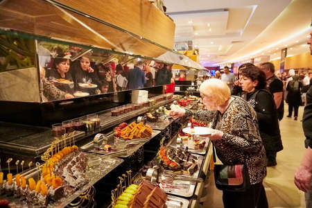 Antalia, Turkey - December 21, 2019: Food on the shelves in the self-service buffet with all inclusive and people in the hotel in Turkeyのeditorial素材