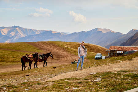 Gudauri, Georgia - October 19, 2019: Observation deck and tourist people near it during travel to Gudauri in Georgia in autumn, summer or spring dayのeditorial素材