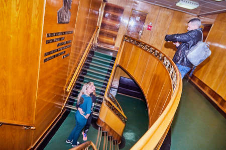 Murmansk, Russia - June 21, 2019: Group of people during an excursion to the ship historical Museum....