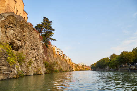 Tbilisi, Georgia - October 21, 2019: River Kura in capital of Georgia Tbilisi in a daytime and sightseeing from the water in a summer, or autumn dayのeditorial素材