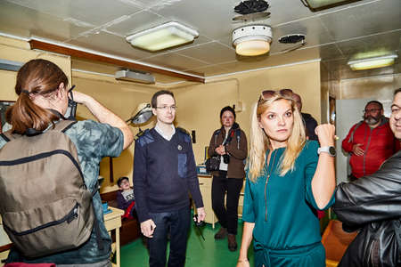 Murmansk, Russia - June 21, 2019: Group of people during an excursion to the ship historical Museum....