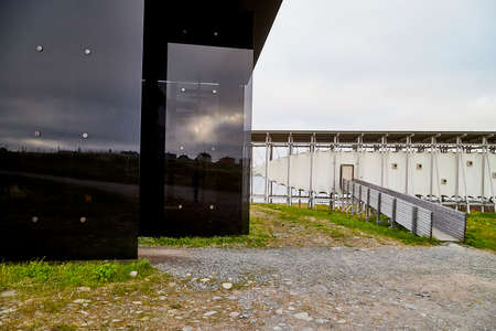 Vardo, Norway - 23 June 2019: Black kube building which is memorial devoted to memory innocently...