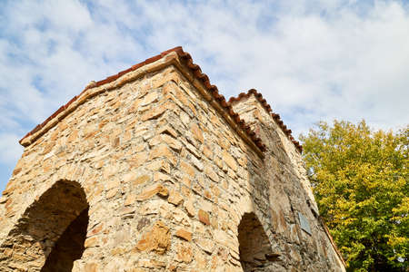 Orthodox church in Jvari Monastery located near Mtskheta, Georgia. Old house built of yellow stones...