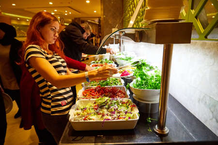 Antalia, Turkey - December 15, 2019: Food on the shelves in the self-service buffet with all...