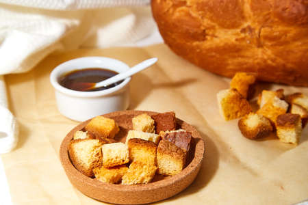 Square toasted pieces of homemade delicious rusk, hardtack, Dryasdust, zwieback, bread and Liquid...