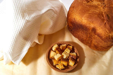 Square toasted pieces of homemade delicious rusk, hardtack, Dryasdust, zwieback and bread on a white...