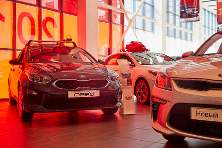 Murmansk, Russia - June 21, 2019: Cars in showroom of dealership KIA in Murmansk city in Russiaのeditorial素材