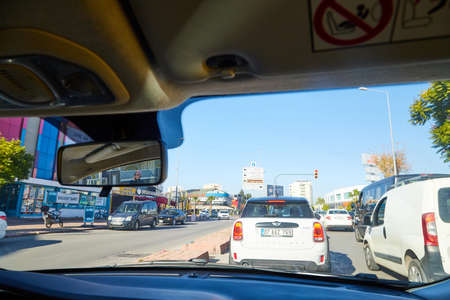 Antalya, Turkey - December 19, 2019: View from the car window on the street of the modern city of...