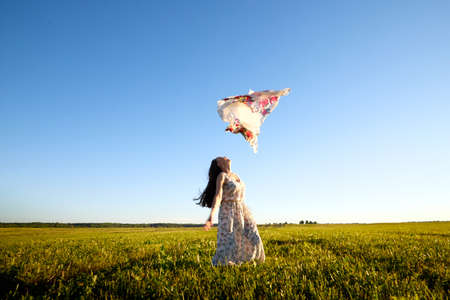 Beautiful woman or girl with magnificent figure and plastic movements walking and dancing in green...