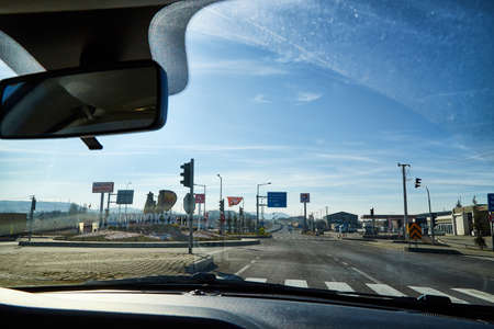 Antalya, Turkey - December 20, 2019: View from the car window on the street of modern city in Turkey...