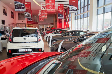 Murmansk, Russia - June 21, 2019: Cars in showroom of dealership KIA in Murmansk city in Russiaのeditorial素材