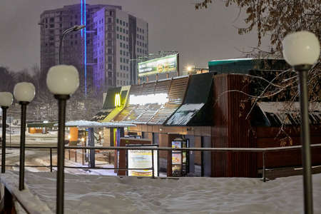 Kirov, Russia - February 25, 2020: McDonald's building with lighting in city in winter with snowのeditorial素材