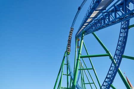 Roller coaster Ride against blue sky in a nice sunny dayの写真素材