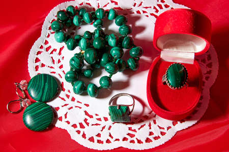 Jewelry from green malachite. Malachite beads and earrings in the studioの写真素材
