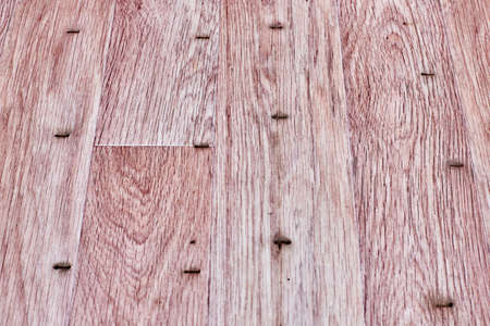 Linoleum flooring with embossed wood texture. Imitation wooden floor in pink colorの写真素材