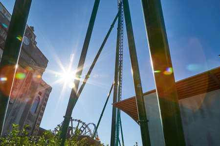 Roller coaster Ride against blue sky in a nice sunny dayの写真素材