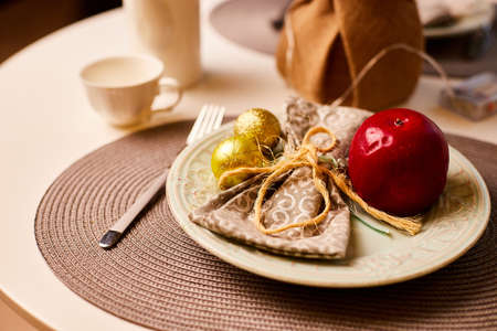 Christmas table decoration. Plate with Christmas ball