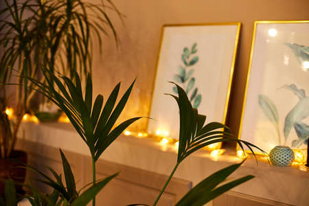 Kirov, Russia - December 02, 2020: Cozy home corner with picture in the room decorated for Christmasのeditorial素材