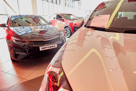 Murmansk, Russia - June 21, 2019: Cars in showroom of dealership KIA in Murmansk in Russia