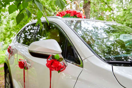 Decorations for a wedding car in Russia. The car of the newlyweds on summer dayの写真素材