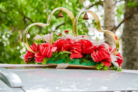 Decorations for a wedding car in Russia. The car of the newlyweds on summer dayの写真素材
