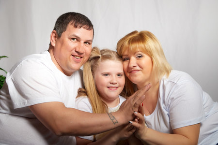 Kirov, Russia - April 25, 2021: Happy family with parents and child in room. Mother, father, daughter having fun togetherのeditorial素材