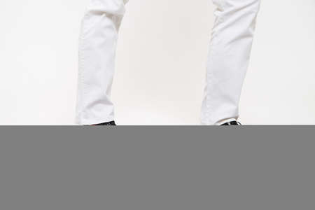 Black female or male patent leather shoes on legs of woman. Shooting for catalog or an online store. A pair of shoesの写真素材