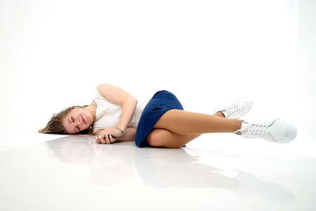 Beautiful young woman or girl wearing casual clothes on white background. Young female model posing during photo shootの写真素材