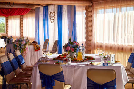 Bouquet of flowers on banquet table. Decoration in wedding restauran for rest