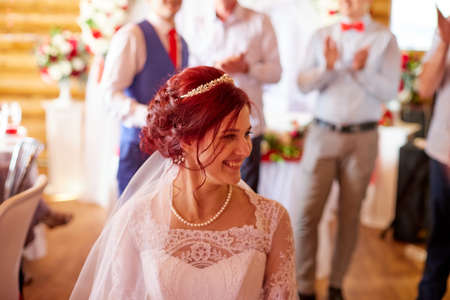 Kirov, Russia - June 20, 2020: Bridge and groom during games at a traditional Russian wedding. People celebrate wedding and having fun togetherのeditorial素材