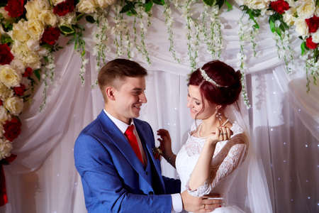 Kirov, Russia - June 20, 2020: Newly married couple at the wedding Banquet at the richly laid table. Russian traditional holiday with bride and groomのeditorial素材
