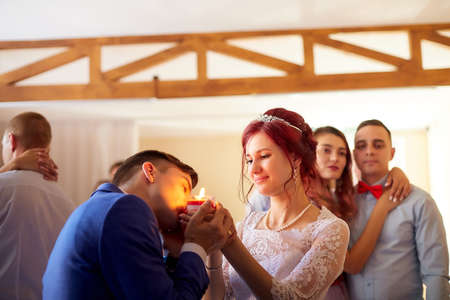 Kirov, Russia - June 20, 2020: Bridge and groom dancing together indoors and many people backgroundのeditorial素材