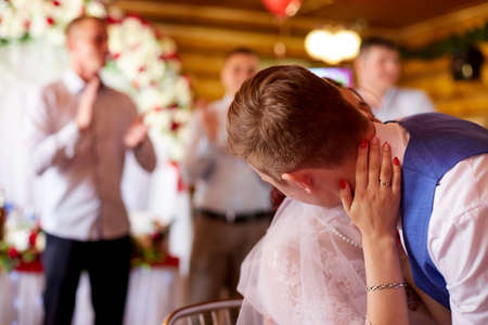 Kirov, Russia - June 20, 2020: Bridge and groom during games at a traditional Russian wedding. People celebrate wedding and having fun togetherのeditorial素材