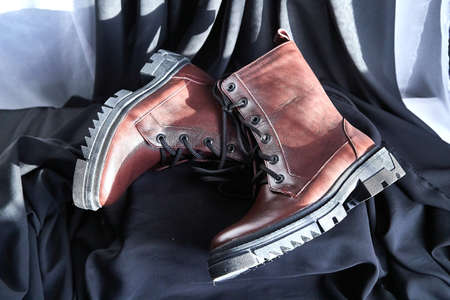 Female winter, autumn or spring brown leather shoes. Fashionable modern photography for store, catalog, magazine or onlineの写真素材