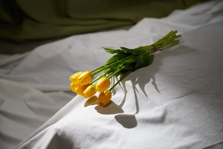 Flowers in vase standing on white background in studioの写真素材