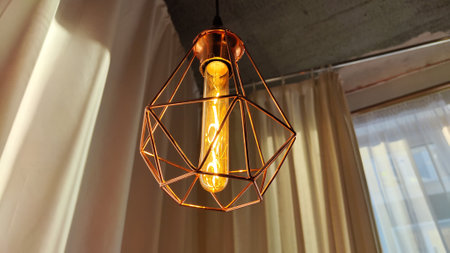 Metal geometric gold lamp chandelier lamp in loft style and curtainsの写真素材