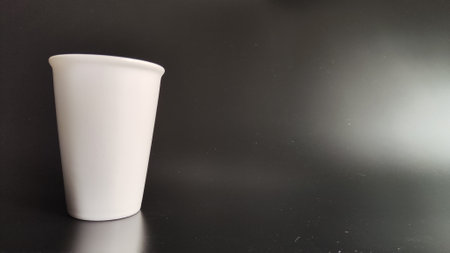 White coffee mug with black background with empty copy spaceの写真素材