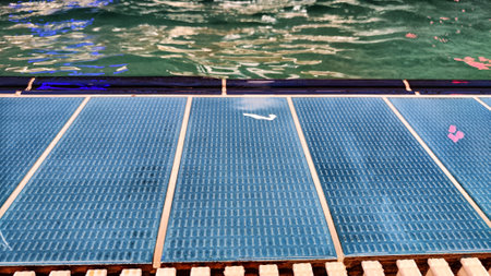 Water and the bottom of pool with green water and tiles. Background and textureの写真素材