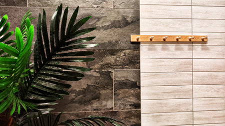 Trendy gardening background with leave of Green palm inside of big place. Indoor Eco-Friendly Trend for office design. Decoration of trendy jungle for swimming pool, sauna, steam room, water parkの写真素材