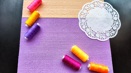 Abstract background with texture and frame with beige and lilac or purple velvet paper, a white...