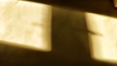 Window natural shadow overlay blurred effect on white texture background. Shadows and light from the window on the wall for abstract frame, texture, background. Hard shadows and contrastsの写真素材