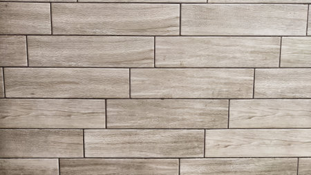 Beige brown wooden planks, strips wall cladding interior panel of natural wood. Laminate sheet floor...