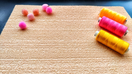 Top view on bstract background with texture and frame with beige velvet paper and color pink, yellow...