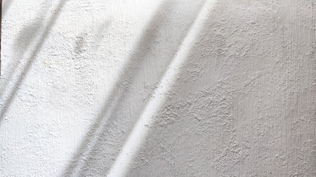 Abstract pattern with stripes and lines of shadow and light from sun on textured white whitewash, plaster, paint. background and textureの写真素材
